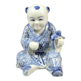 Chinese Blue & White Porcelain Seated Boy Figurine, 1980s For Sale