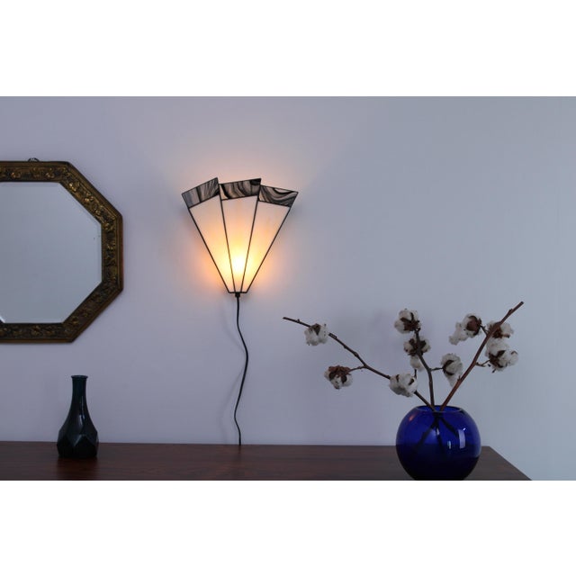 Wall lamp made of metal and stained glass look -the glass is in fact opaque acrylic and gives a very atmospheric light....