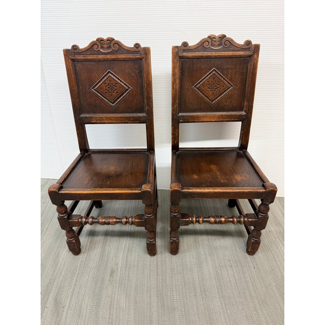 Design Plus Gallery presents a Pair of Oak Wood Side Chairs from the 17th Century. It's quite a feat to have a pair of...