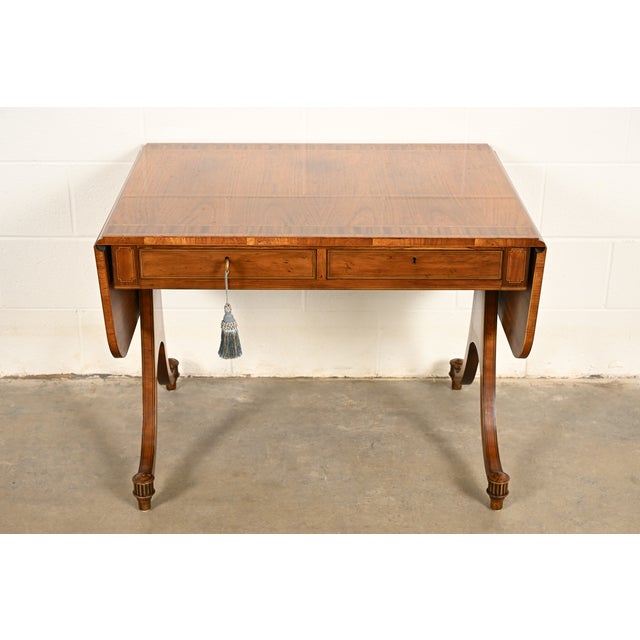 An exceptional Regency or Georgian style drop leaf writing desk or console table By Baker Furniture USA, Circa 1980s Book-...