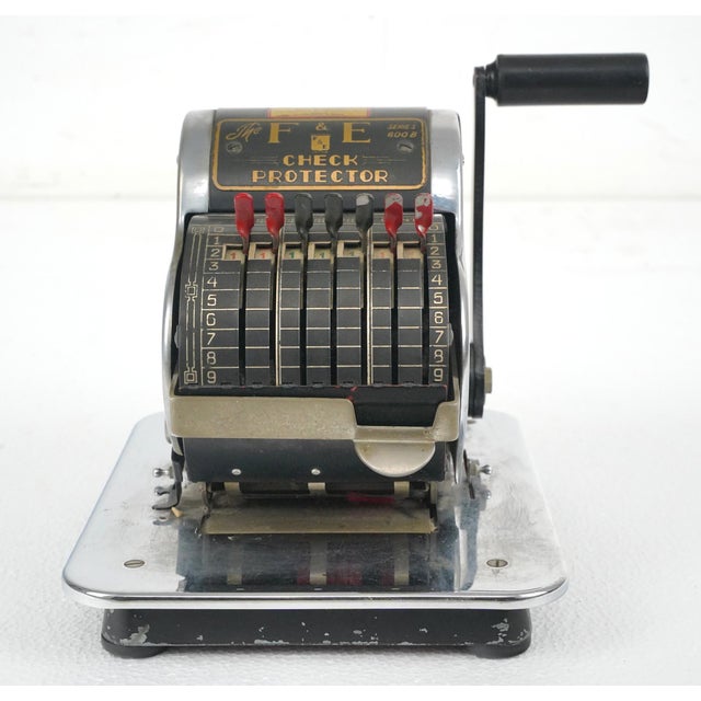 Vintage mechanical F & E Check Protector. It is made of steel with black and chrome finishes. Lightning Series 800B....