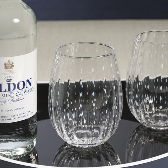 Spice up your dinner parties with glasses that shine. This set of 4 tumblers features white dotted pattern. Fun with just...