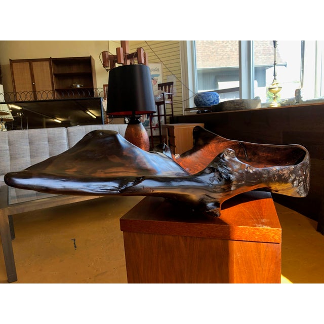 Large sculptural burl wood bowl with a smooth interior and an exterior that is both softly polished and naturally gnarled,...