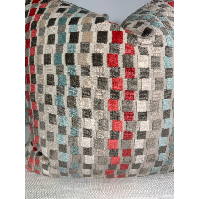 Custom pair of 22" pillows covered in a cut velvet epingle fabric in a geometric stripe pattern of coral, aqua, and beige...