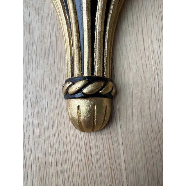 A pair of vintage, 11.5-inch tall architectural wall brackets in a refined Neoclassical silhouette. These substantial...