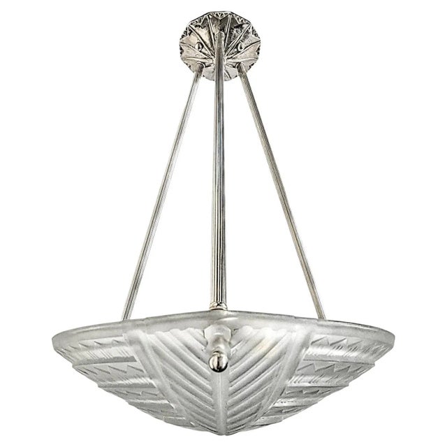 A French Art Deco pendant chandelier by the French artist “Noverdy“ in good condition. Clear frosted molded glass shade...