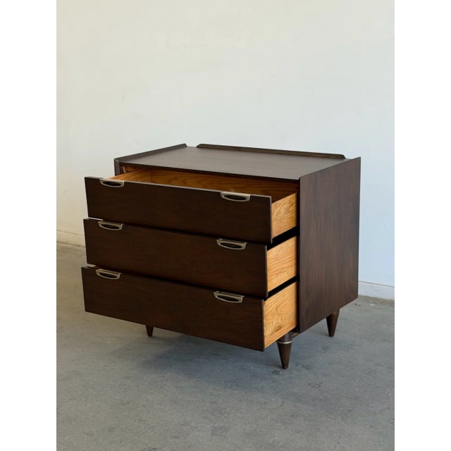 W34 D19 H30 Beautifully refinished Broyhill three-drawer chest in rich walnut, with original hardware . Showcasing clean...