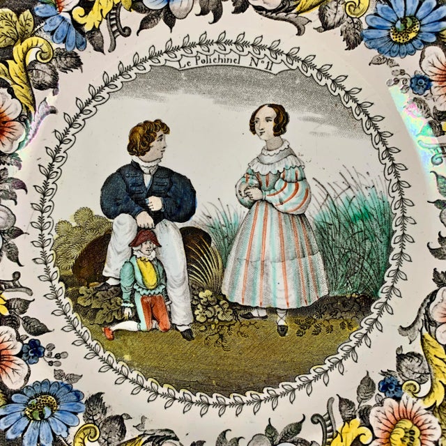 From the Creil region of Northern France, a transfer printed polychrome plate, titled – Le Polichinel. Circa 1830....