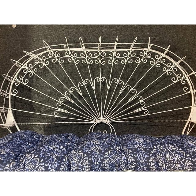 I have a Stunning Vintage 1950-60's Twisted Wrought Iron Patio Peacock Settee Attributed to Salterini. This settee is in...