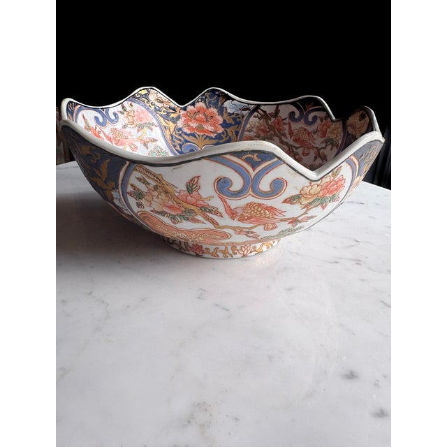Antique Japanese Imari bowl in the classic export palette, dating to the Meiji period, late 19th century. The shaped...