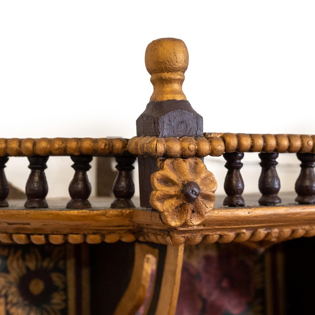 This decorative hand-carved and hand-painted wooden wall cabinet is likely from Rajasthan, India, dating to circa 1910. A...