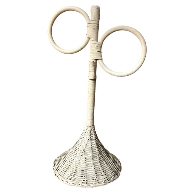 A charming vintage 1980s hand towel stand crafted of woven wicker in a painted white finish. The sculptural double-ring...