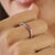 This elegant ring features 0.20 ct round orange sapphires accented by 0.26 ct round diamonds, beautifully crafted in 925...