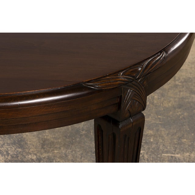 An elegant 1940s French Art Deco dining table, sourced from Provence, France. Handcrafted from solid maple, the table...