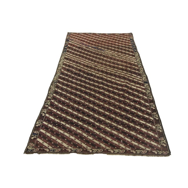 Antique decorative handknotted wool Caucasian rug.Approximately 85-95 years old. In good condition.