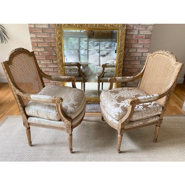 Louis XVI Style Giltwood Fauteuil Armchairs with Caned Back and Damask Upholstery, By Nancy Corzine Upholstered in the...