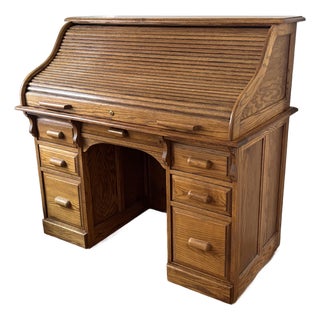 Mid 20th Century Arts & Crafts Raised Panel Oak S Roll Top Desk on Casters For Sale