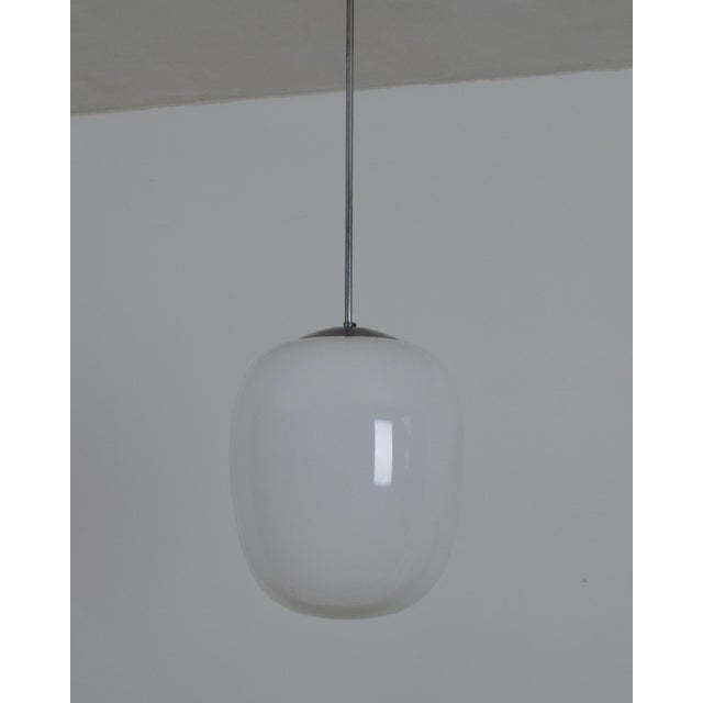 A beautiful, timeless design by designer and Bauhaus professor Wilhelm Wagenfeld from 1952. The lamp creates a lovely...