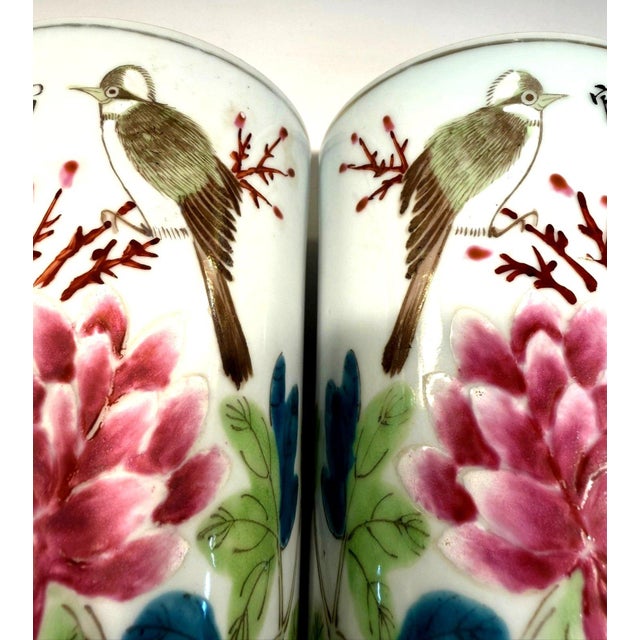 Beautiful matching pair of vintage Chinese famille rose-style porcelain cylinder vases/brush pots featuring colorful...