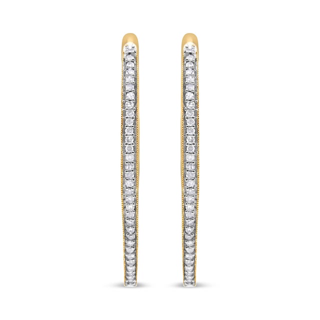 These glamorous 10k yellow gold hoop earrings showcase 1ct of round cut diamonds. The prong set diamonds inlay half the...