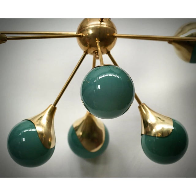 A fantastic spot of green color, amazing design due to its very particular shape of these green glass spheres and for the...