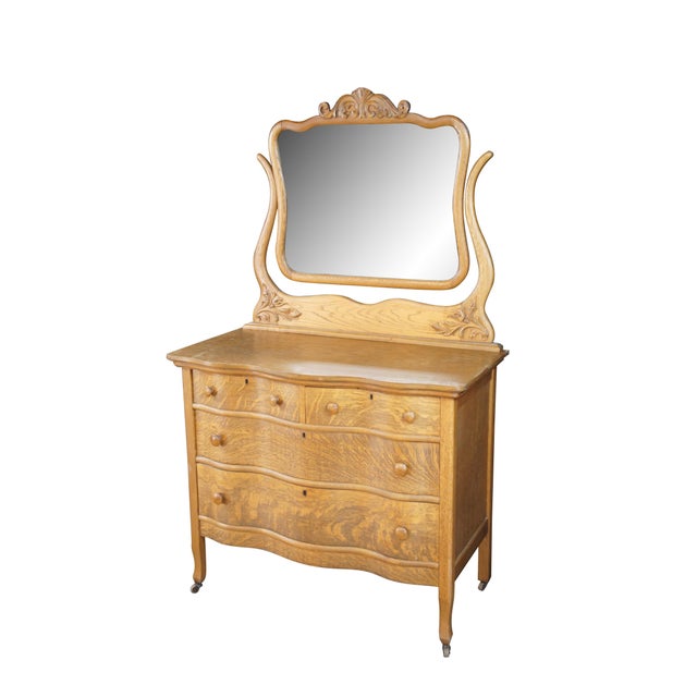 Charming late 19th century Victorian Era Dresser and mirror. Features a quartersawn oak frame with serpentine oxbow front....