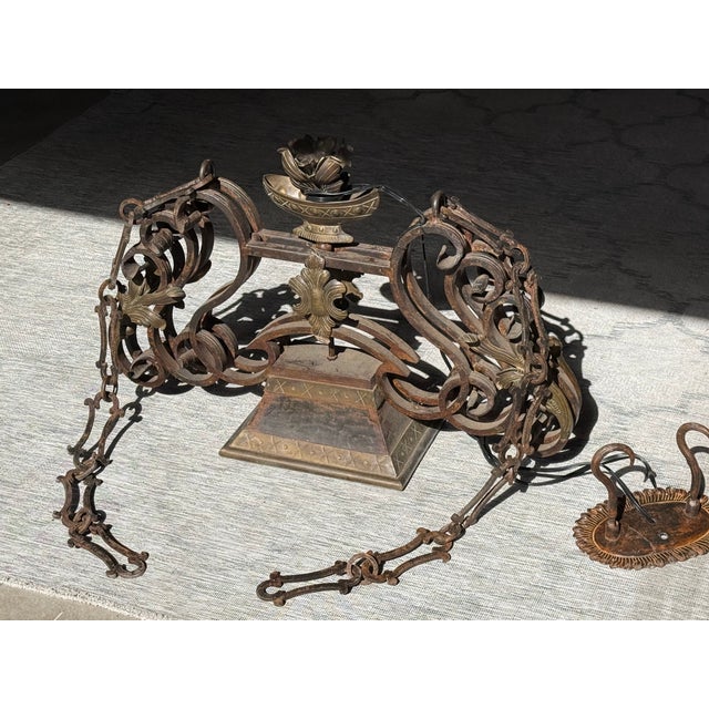 Hand-forged wrought-iron light chandelier/pendant custom-ordered from the Design Center in San Francisco, California.