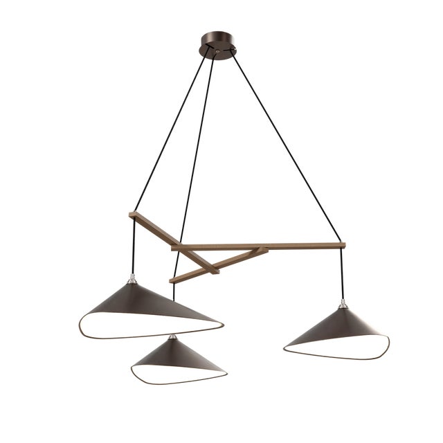 The Emily Group of Three is a horizontal pendant light composed of three individually shaped shades, mounted on a shared...