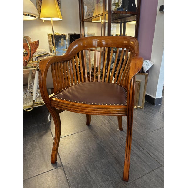 Desk chair / club chair circa 1925, beech, lightly stained with cherry Restored condition, reupholstered in brown leather