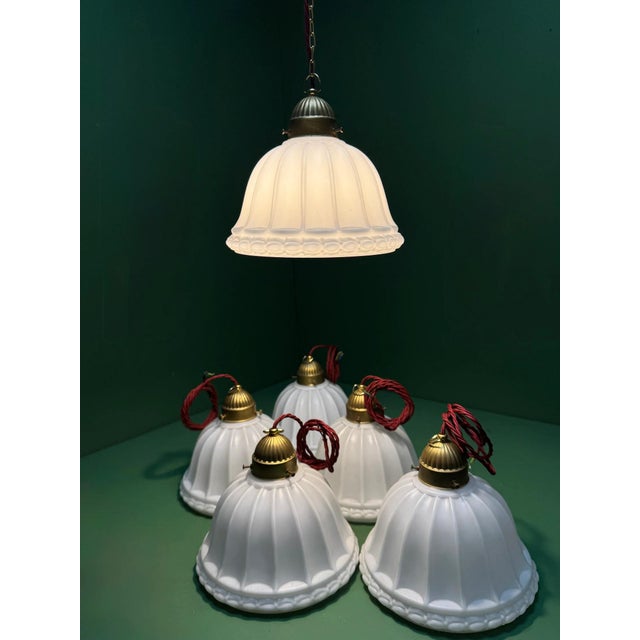 1920s british made opal glass pendant shade with brass domed galleries, fluted glass with an embossed floral band....