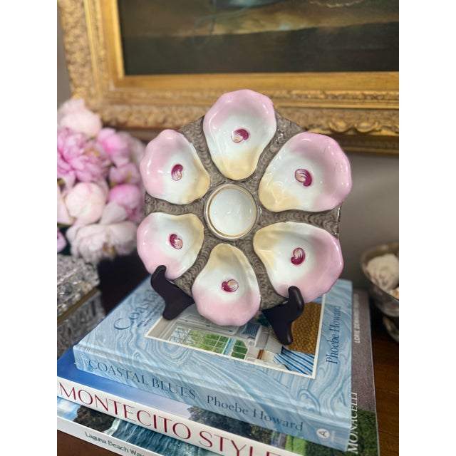 A statement piece for the collector and the entertainer alike. This vintage oyster plate features six softly scalloped...