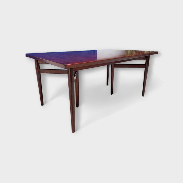 Large dining table designed by Arne Vodder in 1960 and produced by Sibast Furniture, Denmark. The dining table is in...