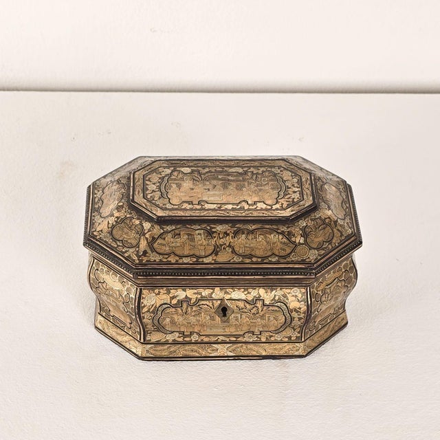 A 19th-century Chinese lacquered and gilt tea caddy.