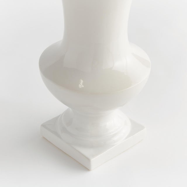 With a trumpet shape and square footed base, this classic decorative vase is made for the traditional space. Add some faux...