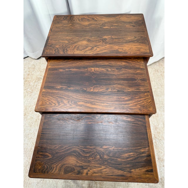 This exquisite set of three Danish Modern nesting tables is attributed to renowned Danish maker Poul Jeppesen (PJ) and...