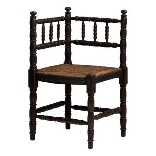 20th Century France Weathered Dark Oak Rush-Seated Spindle-Back Chair For Sale