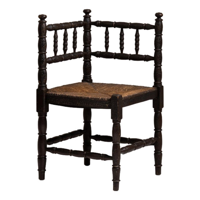 20th Century France Weathered Dark Oak Rush-Seated Spindle-Back Chair For Sale