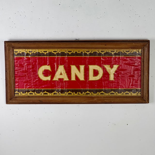 A bright and delicious hand painted on paper CANDY sign in red and gold. It comes in a straightforward wood frame that...