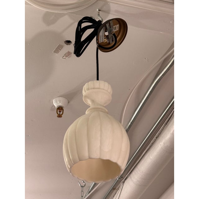 Design Plus Gallery presents a Noah Fluted Pendant Light from Pottery Barn. This pendant showcases a faux stone shade with...