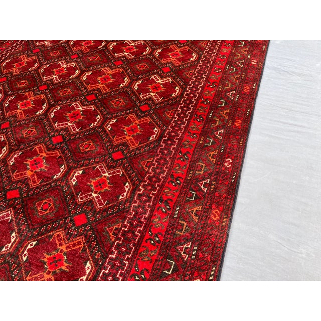 A vintage Afghan Ersari Turkmen rug with the tribe's signature all-over gül design — a dense honeycomb lattice of small...