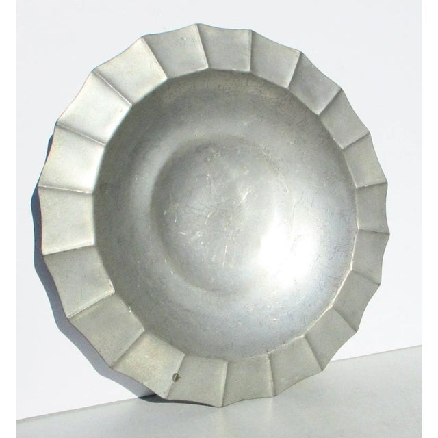 Brewsters Pewter serving tray. Art Deco style with four stacked feet on a shallow serving center bowl. Scalloped wide rim...