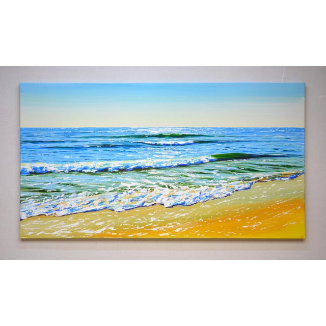 With acrylics, I captured the shimmering dance of light on the sea’s surface, blending impressionism and realism to evoke...