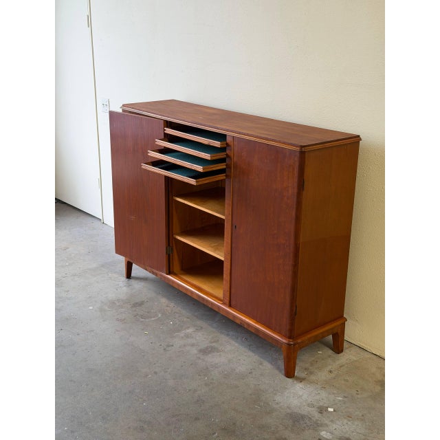 Authentic vintage Danish Mid-Century Modern teak cabinet / sideboard, made in Denmark circa 1960s. This elegant storage...
