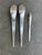 Set of three spoons, two Serving at 11” and one teaspoon at 7 1/4”. All three utensils are marked with the manufacturer’s...
