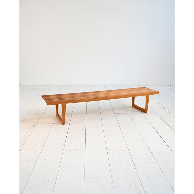 Slatted oak bench. Designed by Yngvar Sandström for Nordiska Kompaniet in the 1960s. Original label present. "Tokyo" bench...