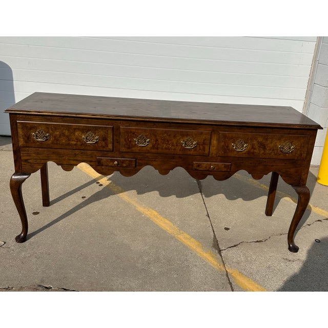 Baker Furniture Co. Oak And Burl Walnut Server with Five Dovetailed Drawers and Carved Apron. Brass hardware. Made in USA...