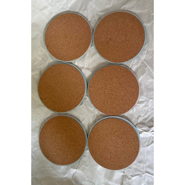 Add a playful dose of retro resort style to your bar cart with this set of six vintage tiki coasters, each decorated with...