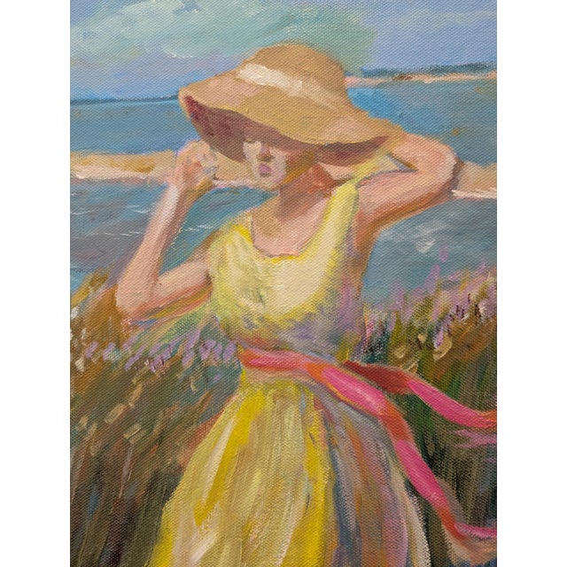 Summer Breeze – 18x24" Oil on Canvas by Paul Scaturro A woman in a flowing yellow dress walks barefoot along a sunlit...