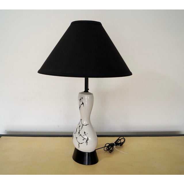 Vintage original Midcentury Modern table lamp for sale. This one is a true gem, and very rare. It was manufactured by...