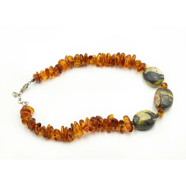 Vintage large freeform baltic honey amber bead necklace featuring sterling silver beaded rondelles as well as an...